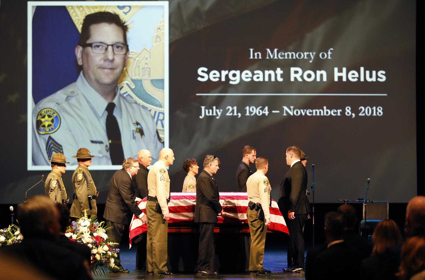 The flag-draped casket of Ventura County Sheriff's Sgt. Ron Helus arrives onstage for a memorial service Thursday at Calvary Community Church in Westlake Village.