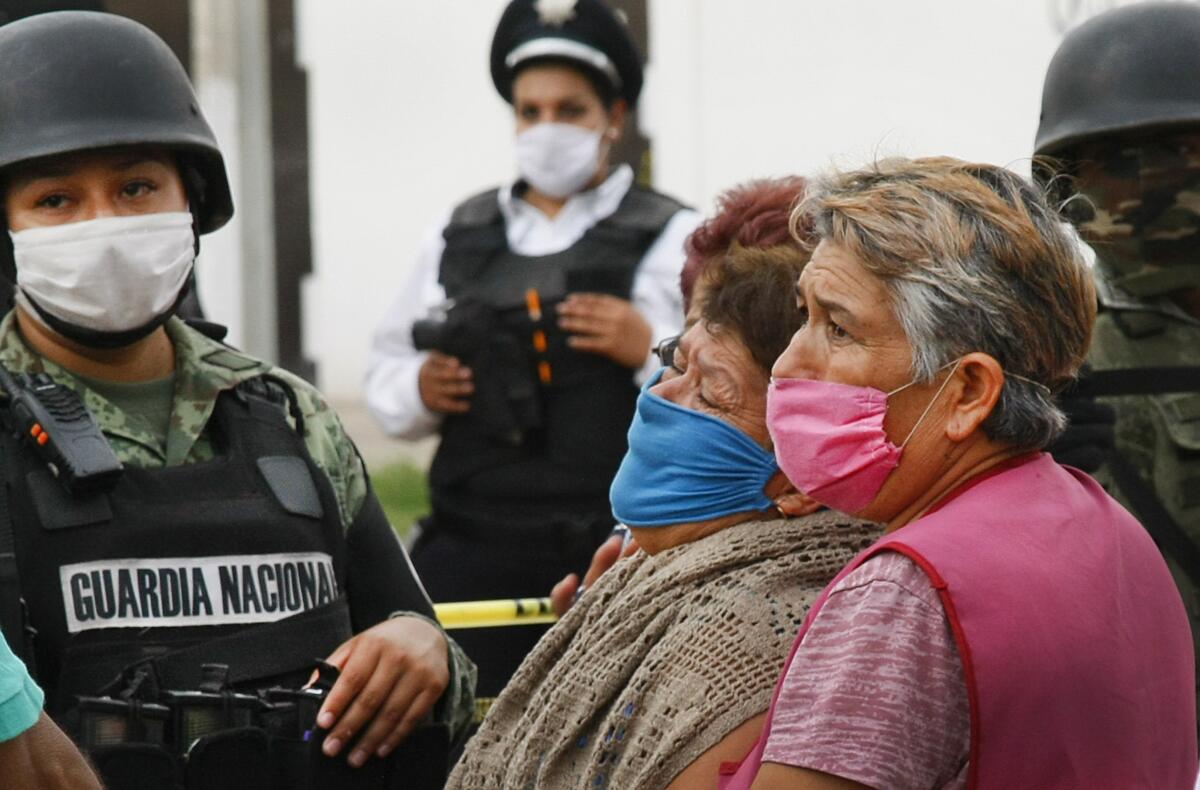 Relatives of  victims wait in anguish for news after a shooting July 1 at a drug rehabilitation center in Irapuato, Mexico. 