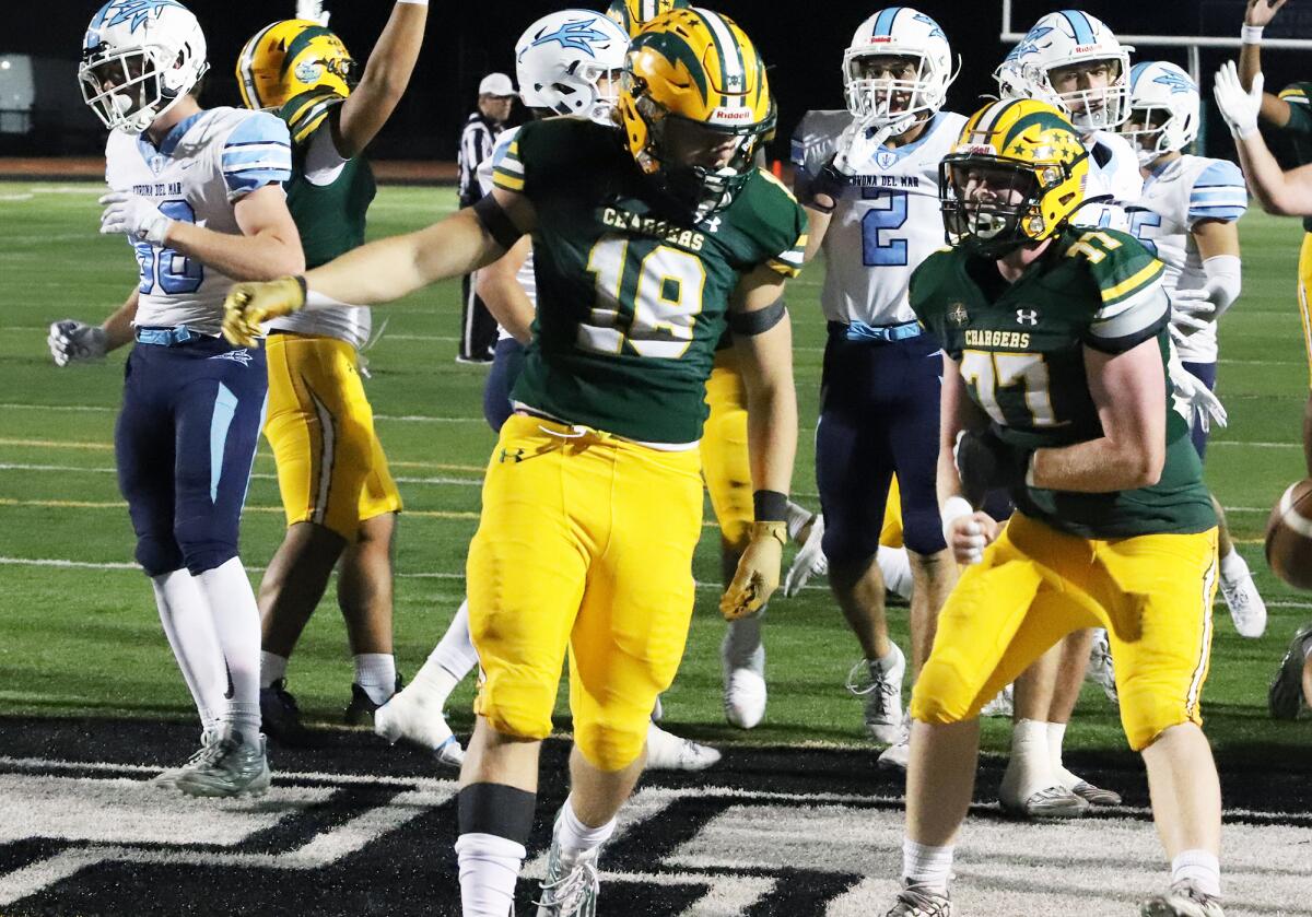 Edison's Julius Gillick (18), shown scoring a touchdown against CdM earlier this season, had a receiving score Friday night.