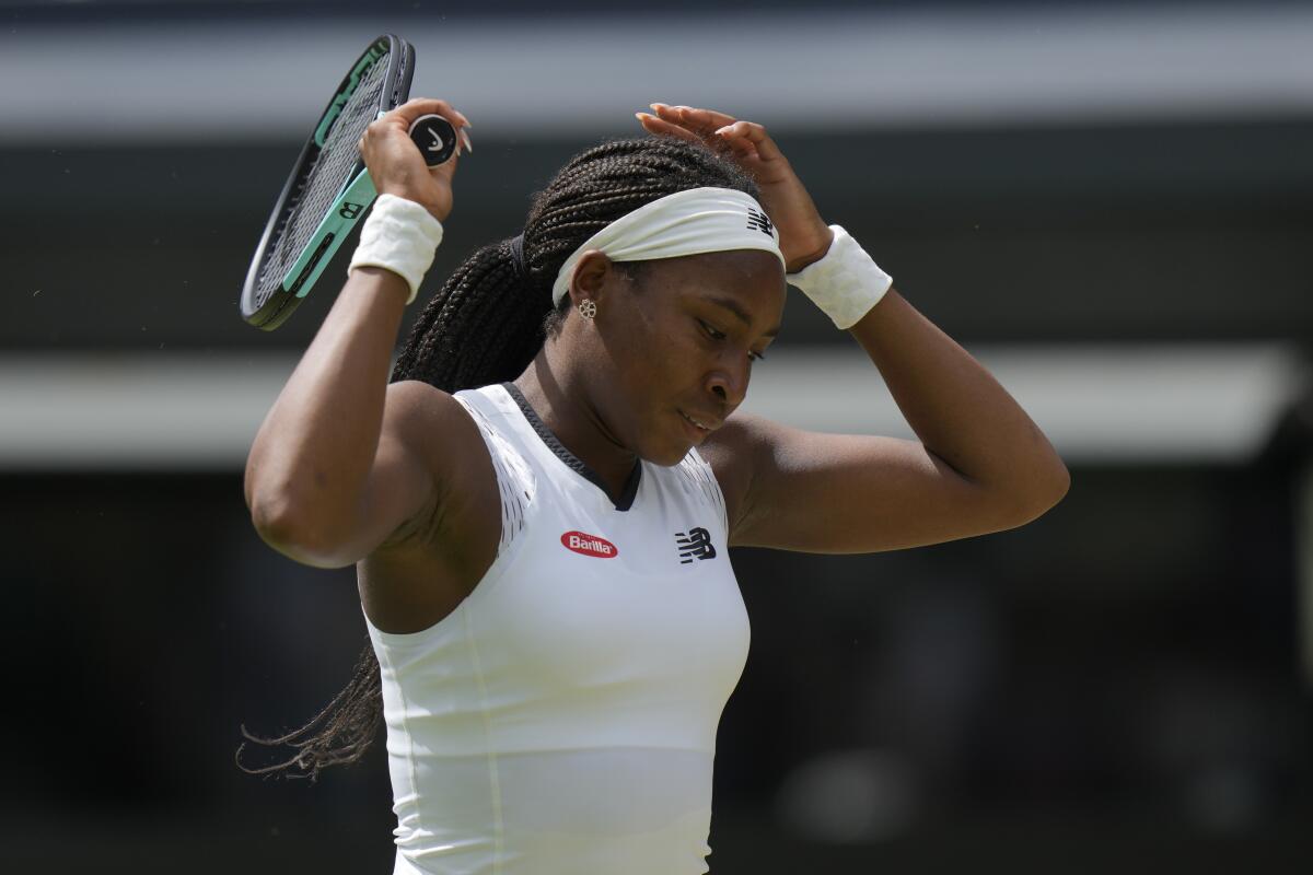Coco Gauff of the US is dejected after losing a point to Amanda Anisimova of the US in a third round women's singles match on day six of the Wimbledon tennis championships in London, Saturday, July 2, 2022. (AP Photo/Alastair Grant)