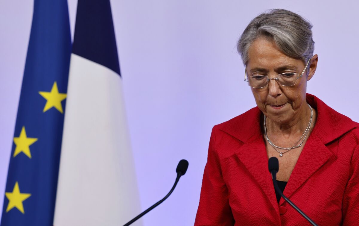 France's Prime Minister Elisabeth Borne reacts as she gives a speech in Paris Sunday June 19, 2022. French President Emmanuel Macron's centrist alliance was projected to lose its majority despite getting the most seats in the final round of the parliamentary election Sunday, while the far-right National Rally appeared to have made big gains. A new coalition — made up of the hard left, the Socialists and the Greens — is projected to become the main opposition force with about 150 to 200 seats of the 577 members of the National Assembly. (Ludovic Marin, Pool via AP)