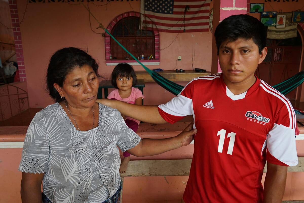 Candido Antonio Romero, 20, with his mother, Carmen Chavez, in Nica, Guatemala. Romero was heading to Michigan, where his father lives, when the truck he was in with other migrants crashed in Mexico on March 7.
