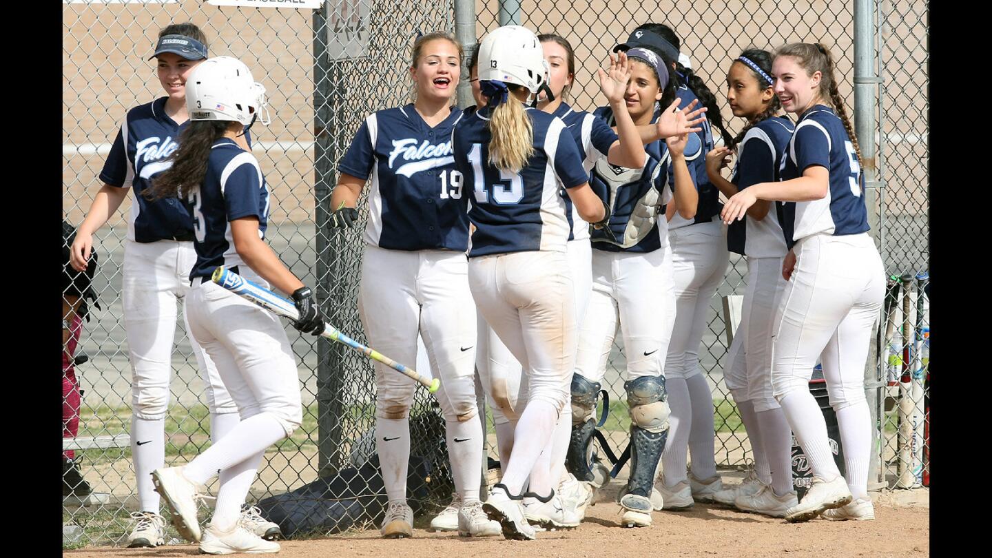 The CV girls softball team congratulates Natalie Bitetti and Jessica Yzaguirre after they scored runs against Glendale during a game on Thursday, April 6, 2016.