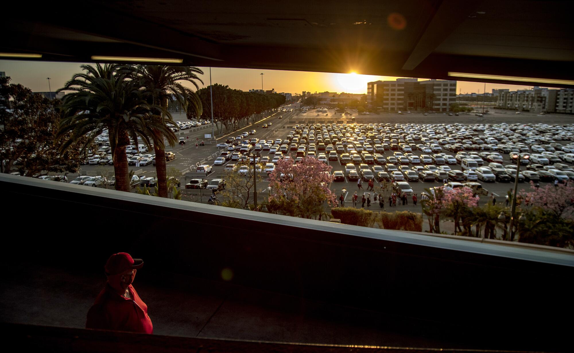 Cars pack the parking lot at Angel Stadium for the team's home opener on April 1.