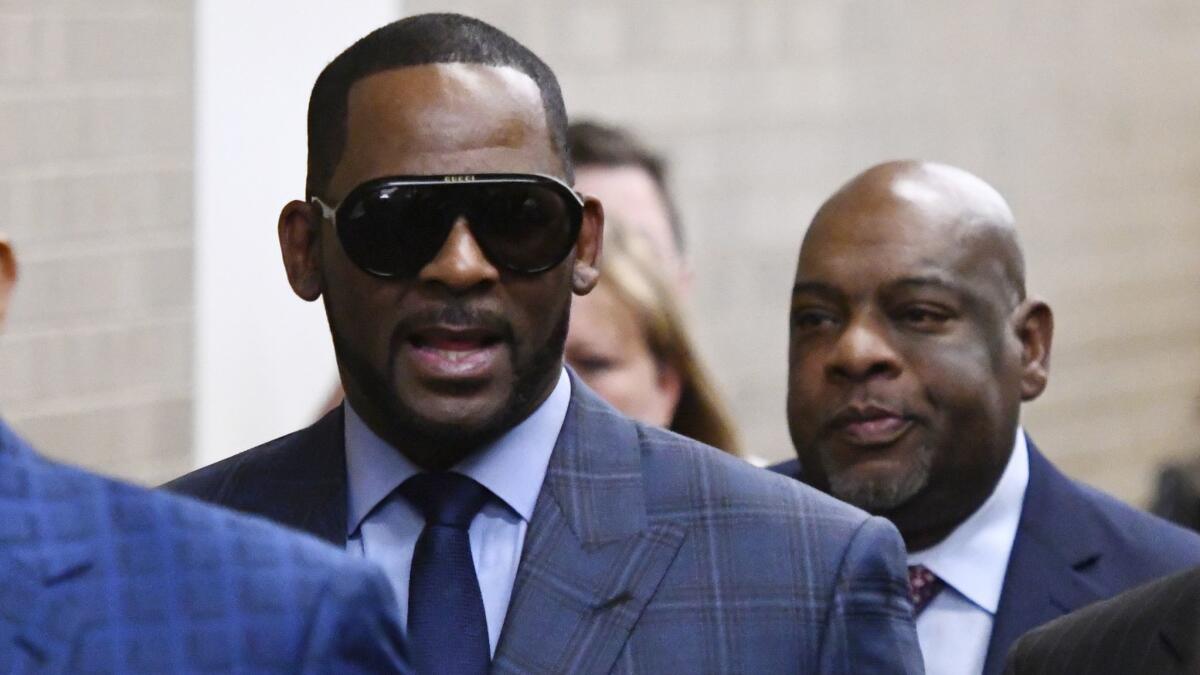 R. Kelly arrives for a hearing in his child support case in Chicago on March 6.