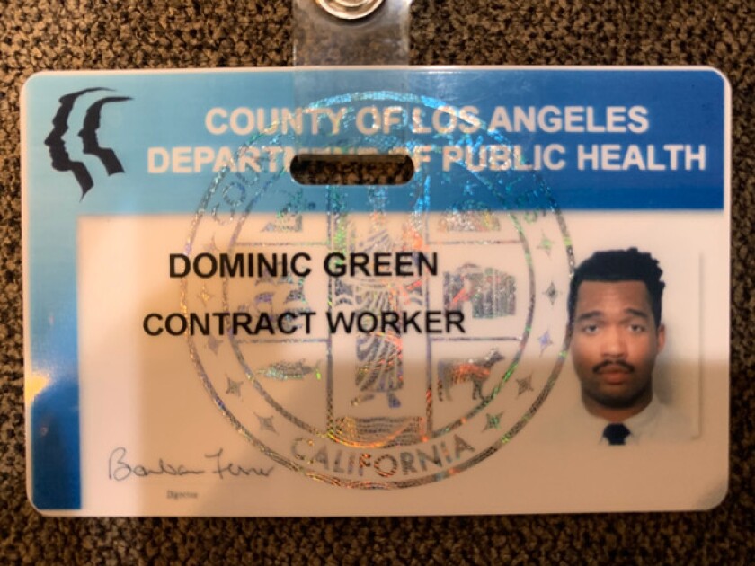 Closeup of a badge that says County of Los Angeles Department of Public Health.