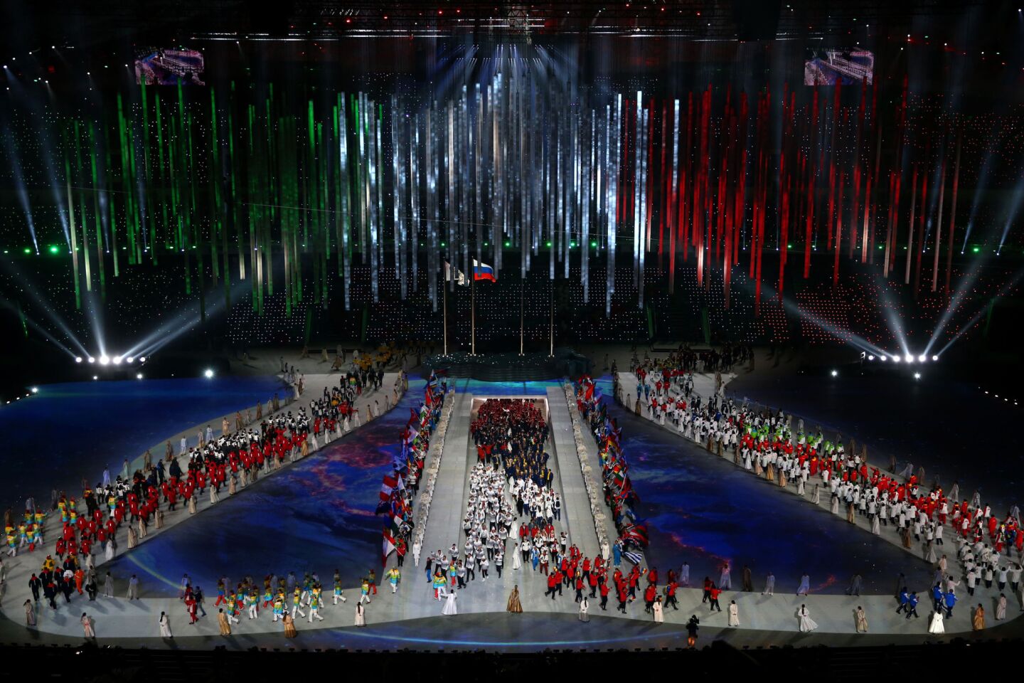 Athletes enter the arena during the 2014 Sochi Winter Olympics Closing Ceremony at Fisht Olympic Stadium.