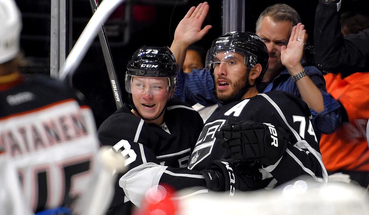 Center Tyler Toffoli, left, celebrates with Dwight King after the Kings scored a goal against the Ducks in the second period Thursday night.