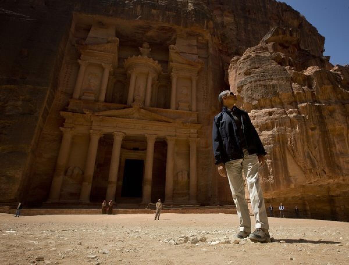President Obama stops to look at the Treasury during his tour of the ancient city of Petra in Jordan Saturday.