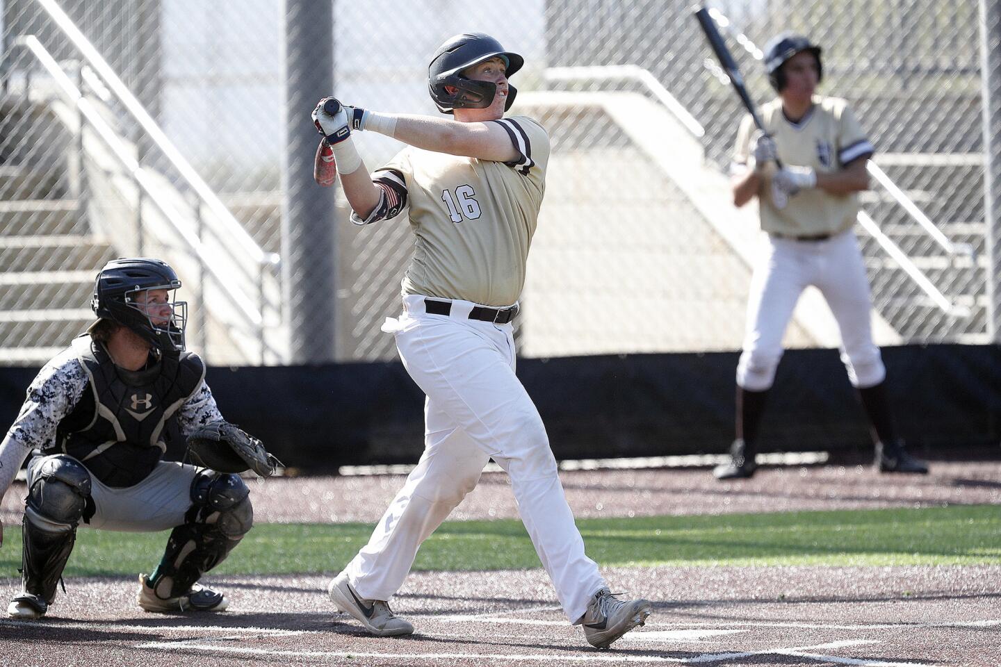 St. Francis' Brendan Durfee watches a high hit ball to deep center field that drops for a triple against Canyon Country in a Valley Invitational Baseball League game at the Glendale Sports Complex on Tuesday, July 3, 2019.