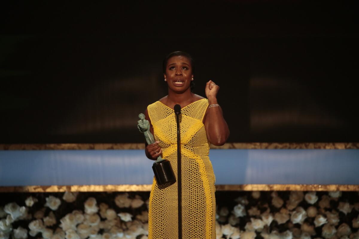 Uzo Aduba accepts her SAG award at the 21st Annual Screen Actors Guild Awards, Jan. 25, 2015.