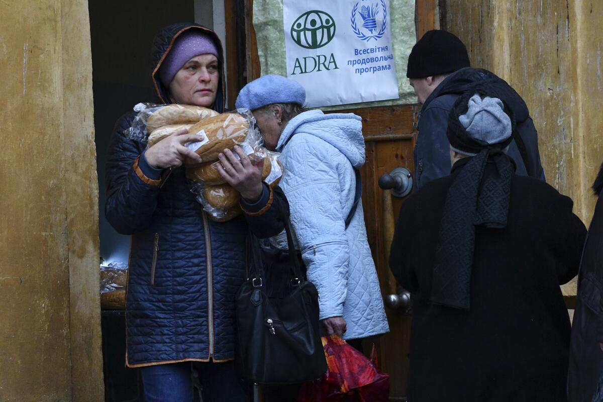 People receiving bread at humanitarian aid center in Kramatorsk, Ukraine