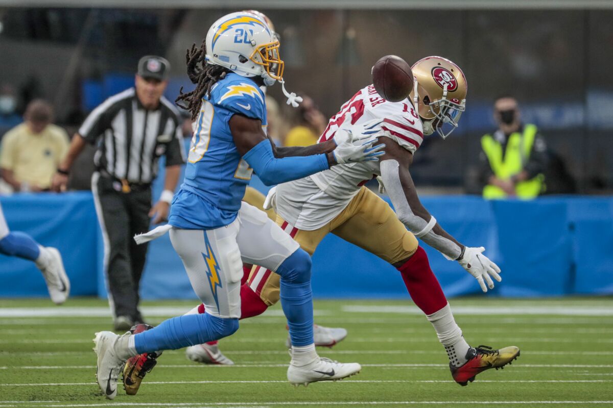 Chargers defensive back Tevaughn Campbell (20) intercepts a pass intended for 49ers receiver Mohamed Sanu Sr.