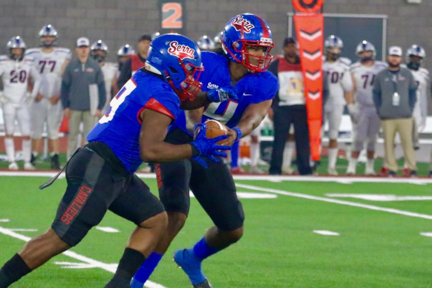 Gardena Serra quarterback Maalik Murphy hands off to running back Cincere Rhaney.