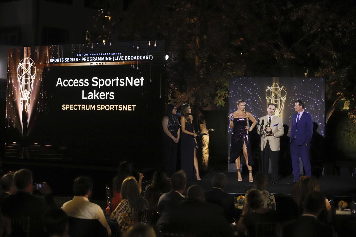 Dave Ramezzano accepts a sports series Emmy on behalf of Spectrum SportsNet's 'Access SportsNet Lakers' show in 2021.