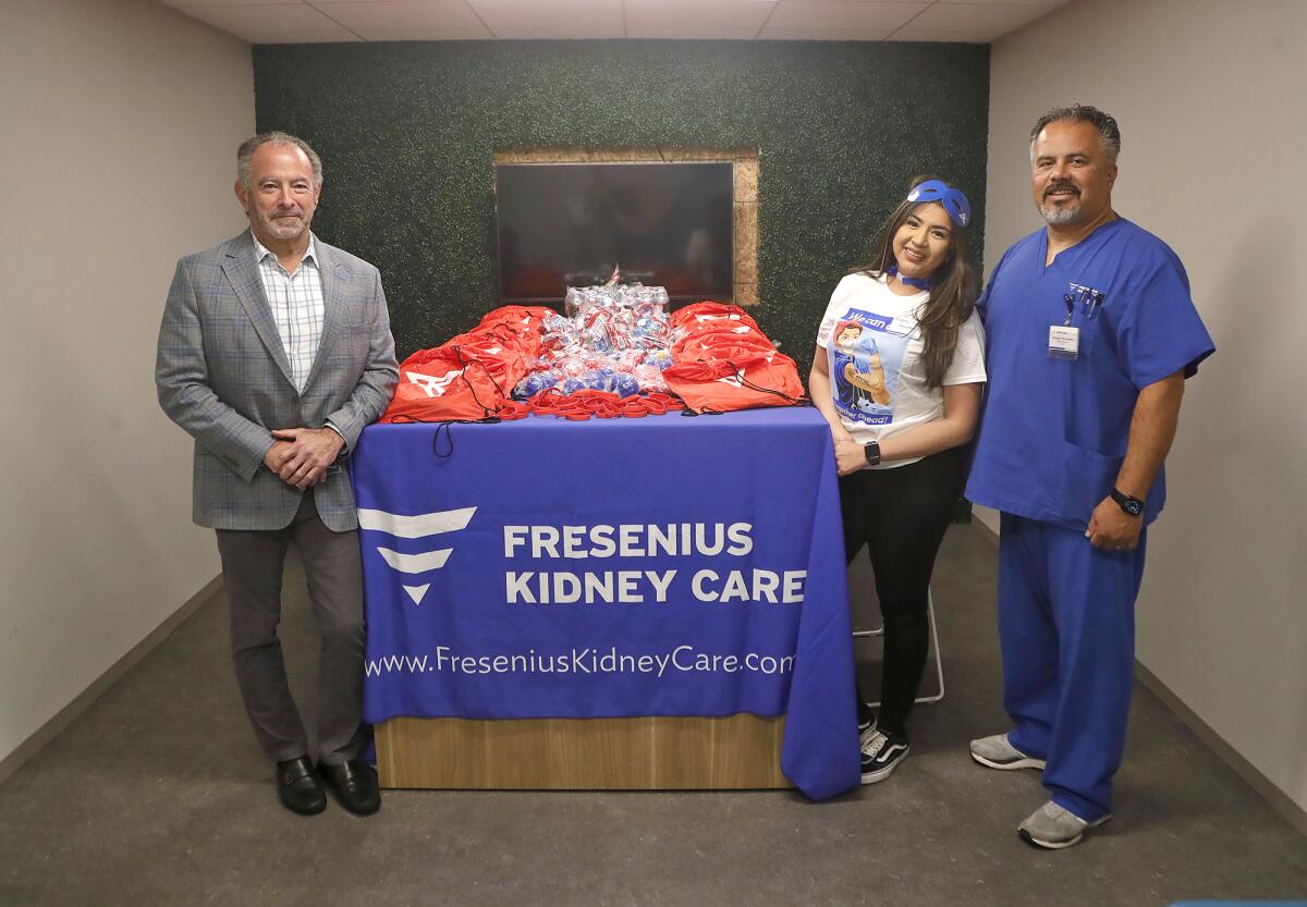 President Dennis Kogod, and nurse volunteers Miguel Hernandez and Gema Singleton, from left, of Fresenius Kidney Care.