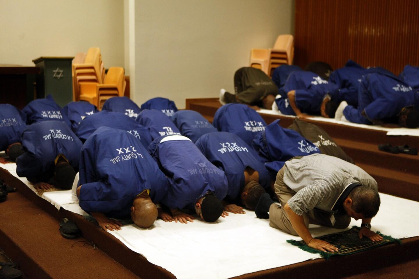 Muslim inmates, led by volunteer Imam Adel Schumann, participate in Jumu'ah prayers in the chapel of Men's Central Jail during the month of Ramadan.