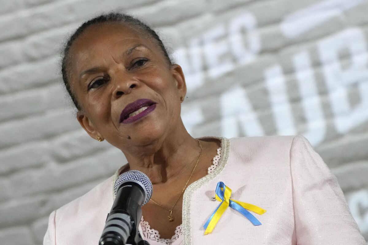 French leftist presidential candidate Christiane Taubira, wearing a ribbon under the colours of Ukraine, delivers a speech in Paris, Wednesday, March 2, 2022. Christiane Taubira announced she withdraws from the race due to the lack of sponsors. All contenders in the presidential race must by law have accumulated 500 signatures of endorsement from local officials like mayors in at least 30 French regions. The two-round presidential election will take place on April 10 and 24, 2022. (AP Photo/Francois Mori)