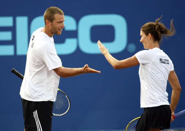 The Newport Beach Breakers' Marie-Eve Pelletier, right, and Travis Rettenmaier celebrate winning a point over St. Louis Aces Liezel Huber and Jean-Julien Rojer.