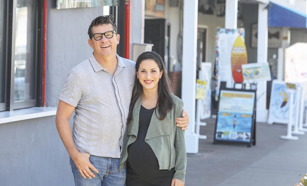 San Diego Magazine owners Troy (left) and Claire Johnson.