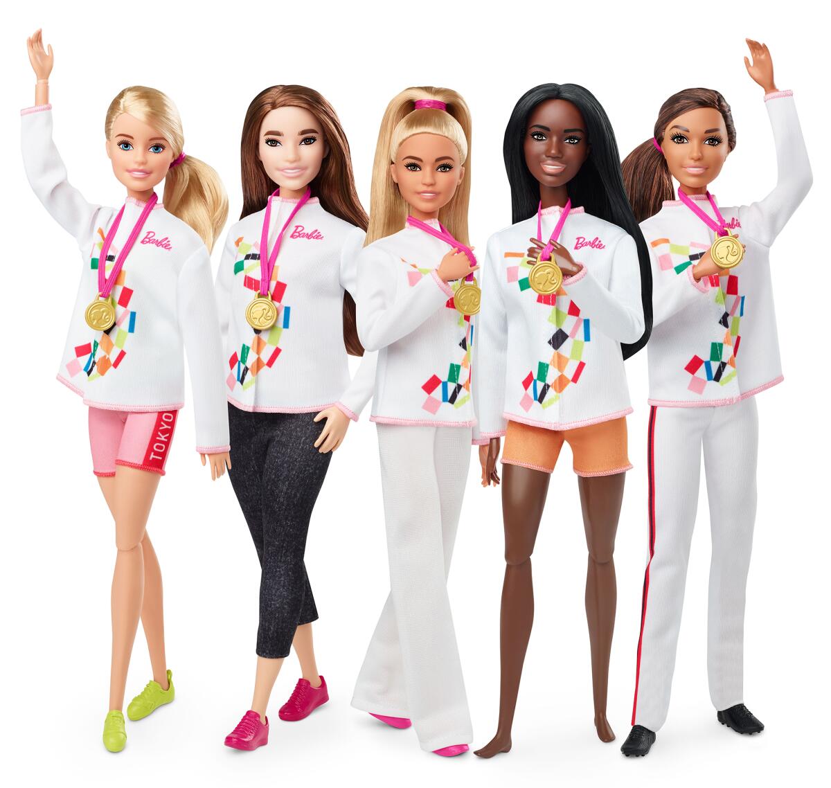 Five Barbie dolls wearing athletic apparel and gold medals