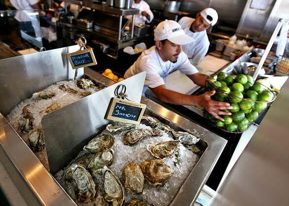 Oysters are displayed by the open kitchen at Blue Plate Oysterette in Santa Monica.