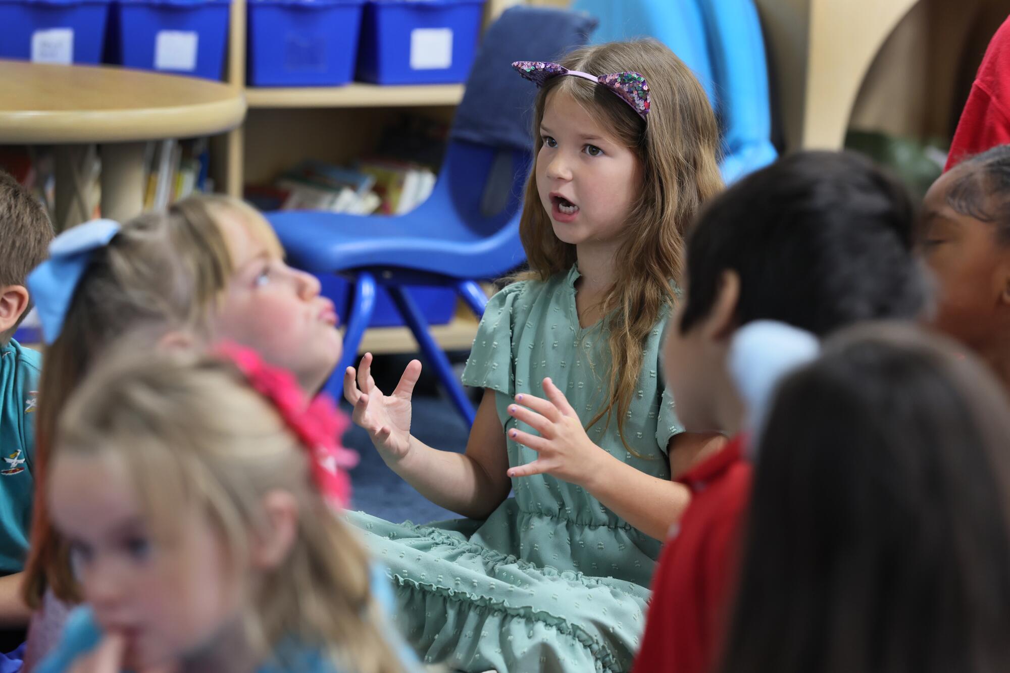 Kindergarten student Lauren Van De Kreeke answers a question at Mark Twain Elementary School in Long Beach.