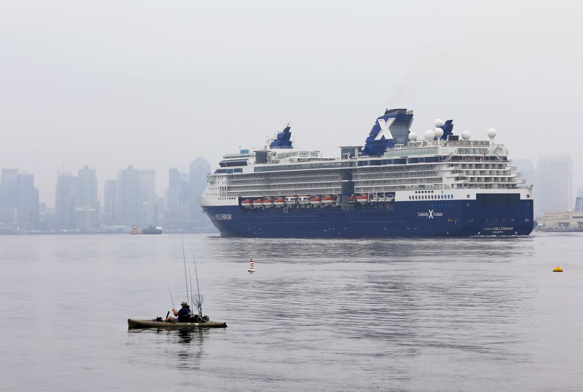 Passing a pair of kayaking fishermen, the cruise ship Celebrity Millennium pulls into San Diego Bay. The ship was returning to the B Street Pier on Friday, May 1, 2020, and before that was anchored just off the coast of San Diego.