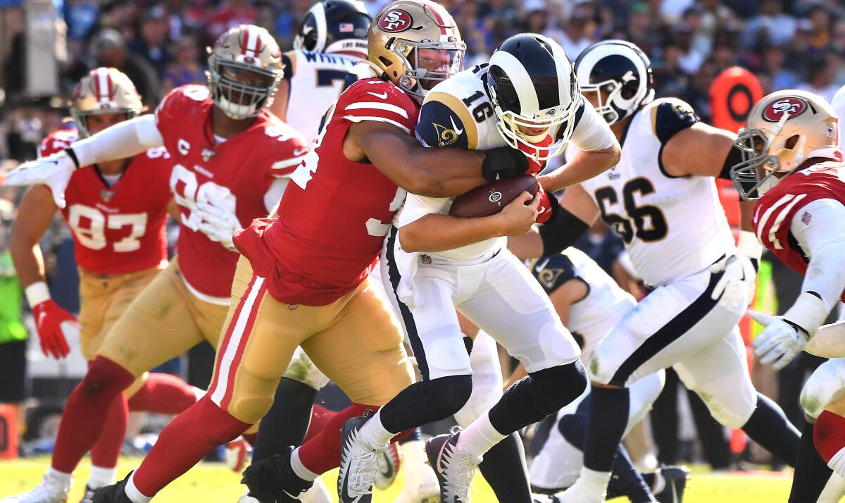 Rams quarterback Jared Goff is sacked by 49ers defensive end Solomon Thomas during the third quarter of the Rams' 20-7 loss at the Coliseum on Sunday.