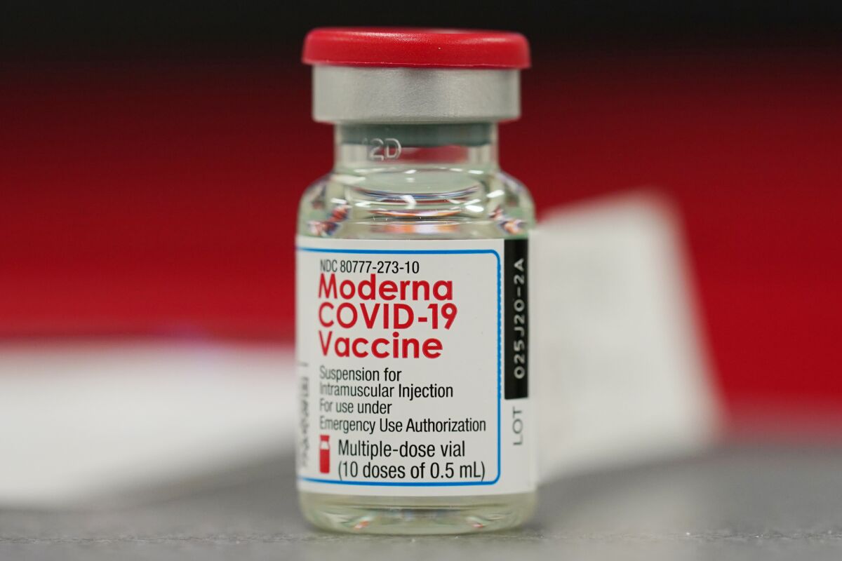 A vial of the Moderna COVID-19 vaccine in the first round of staff vaccinations at a hospital in Denver.