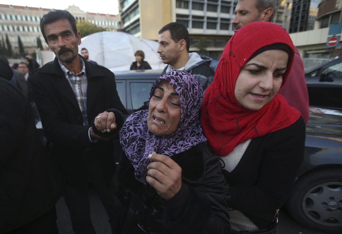 Zainab Bazzal, center, the mother of Lebanese security officer Ali Bazzal, who was kidnapped by Islamist militants, receives help in Beirut in late November after seeing a picture of her son. Al Nusra Front announced that it has killed Bazzal.