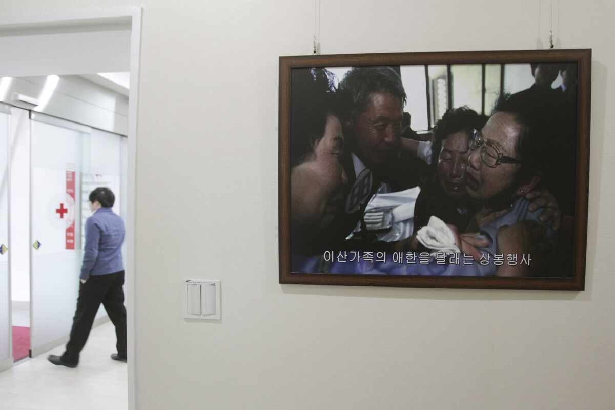 A framed photograph from the emotional 2010 reunification of divided Korean families hangs on the wall of South Korea's Red Cross headquarters in Seoul. North Korea has proposed another reunion, but a similar plan was canceled last year just four days before it was to have started.