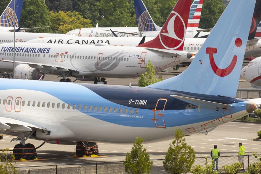RENTON, WA - MAY 31: Workers stand near Boeing 737 MAX airplanes as they sit parked at a Boeing facility adjacent to King County International Airport, known as Boeing Field, on May 31, 2019 in Seattle, Washington. Boeing 737 MAX airplanes have been grounded following two fatal crashes in which 346 passengers and crew were killed in October 2018 and March 2019. (Photo by David Ryder/Getty Images) ** OUTS - ELSENT, FPG, CM - OUTS * NM, PH, VA if sourced by CT, LA or MoD **