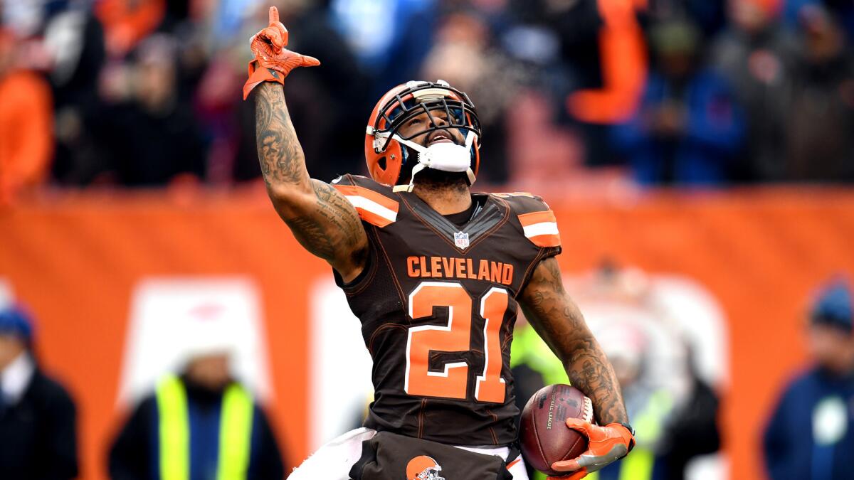 Browns defensive back Jamar Taylor reacts after intercepting a pass by the Chargers during their game Saturday in Cleveland.