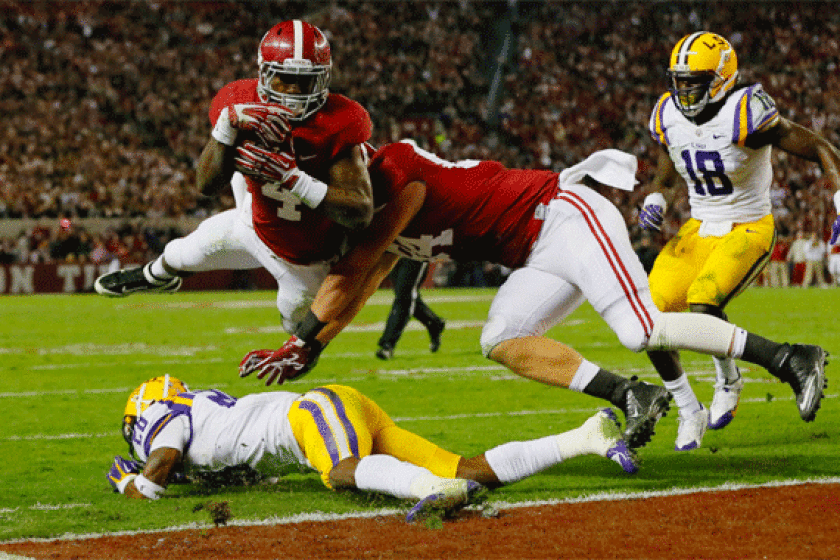 Alabama's T.J. Yeldon scores one of his two touchdowns during the Crimson Tide's 38-17 victory over LSU in Tuscaloosa on Saturday.