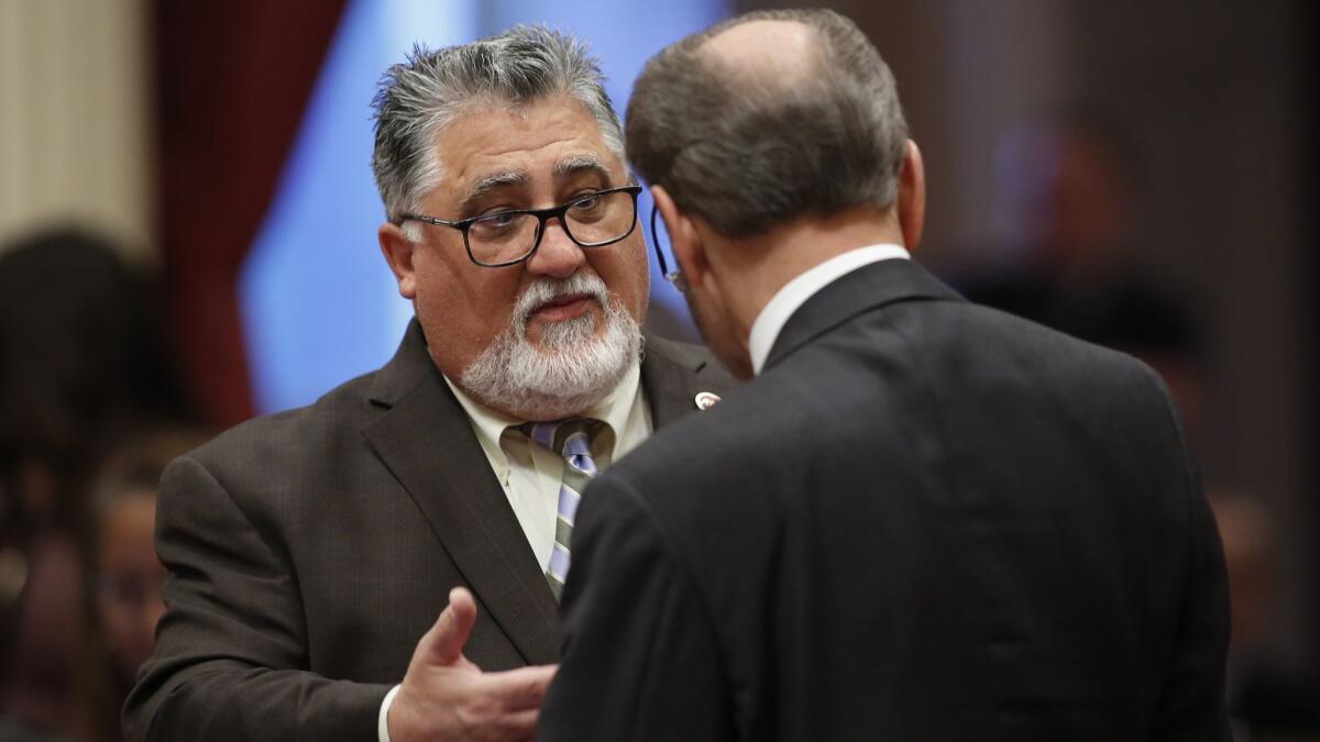 State Sen. Anthony Portantino (D-La Cañada Flintridge), left, talks with Sen. Jerry Hill (D-San Mateo) during a May 16 Senate session at the Capitol in Sacramento.
