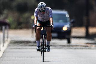 Pasadena, CA, Wednesday, September 4, 2024 -Heat waves rise from the hot pavement as a biker travels along Arroyo Seco outside the Rose Bowl as temperatures hit the mid 90's. (Robert Gauthier/Los Angeles Times)