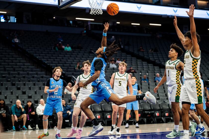 Rob Winn of Sylmar scores two of his 17 first-half points in the Division V final.