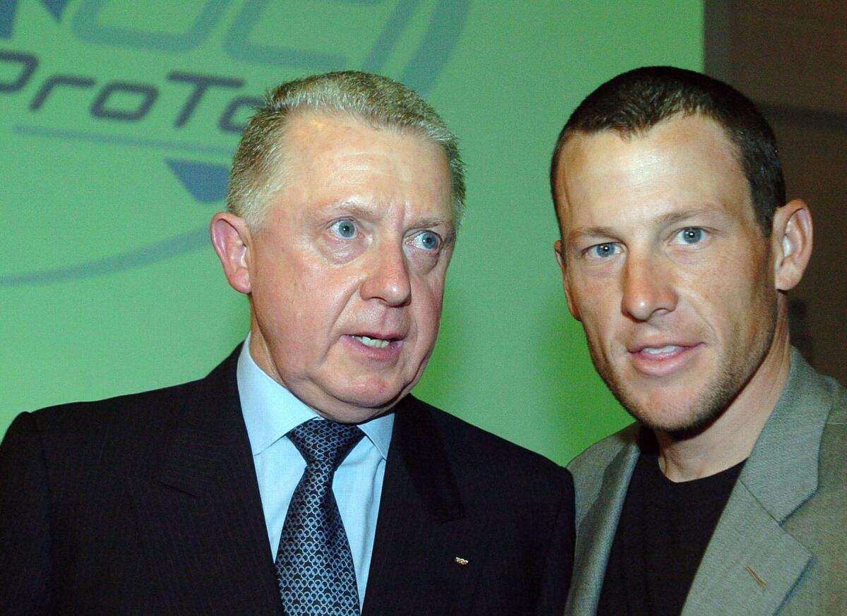 Former International Cycling Union president Hein Verbruggen, left, denies accusations made by Lance Armstrong, shown together in 2005, that he took part in a doping coverup during the 1999 Tour de France.