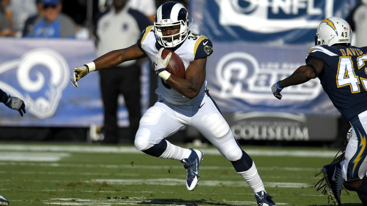 Rams running back Malcolm Brown finds some room to run against the Chargers during the first half Saturday.