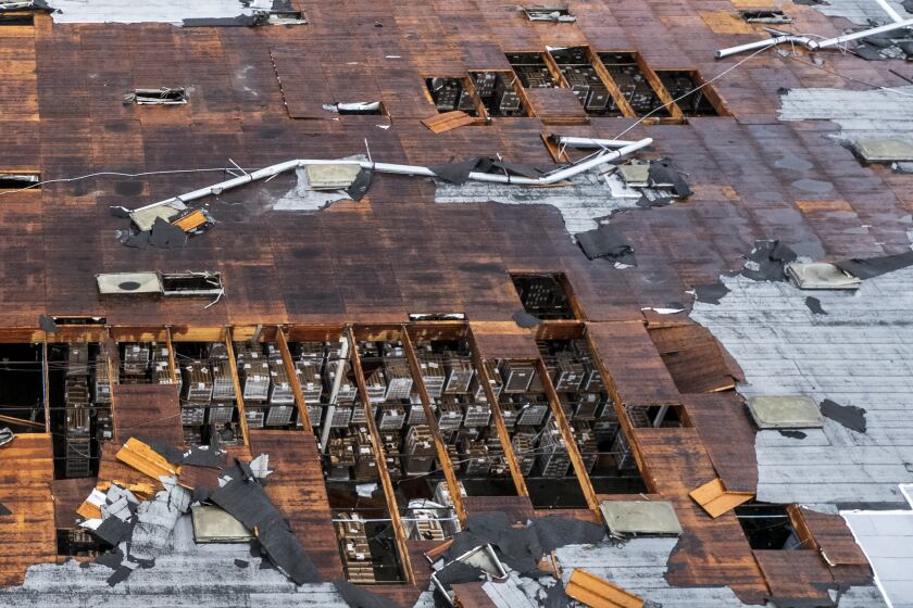 Damage to a building is seen on Wednesday, March 22, 2023 in Montebello, Calif., after a possible tornado. (AP Photo/Ringo H.W. Chiu)
