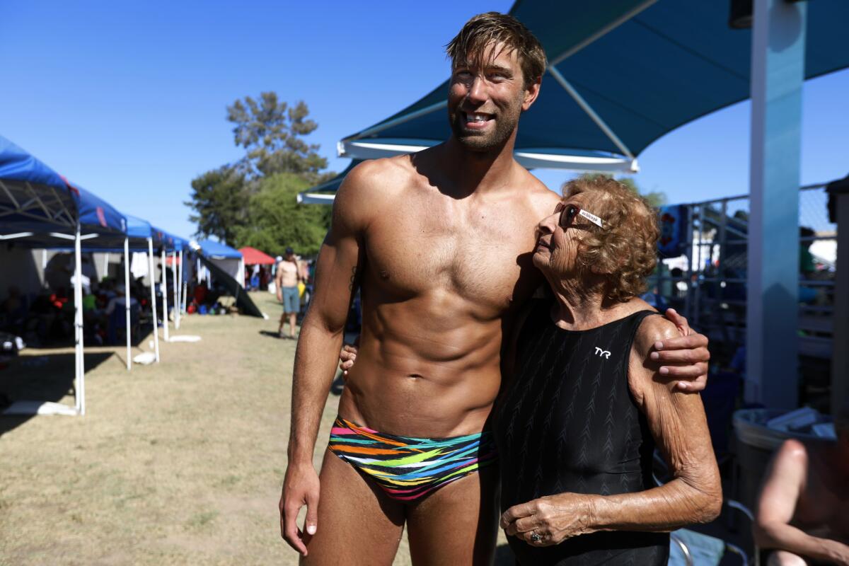 Matt Grevers, 34, left, and Maurine Kornfeld, 97, right, meet at the USMS Spring National Championship. (Francine Orr / Los Angeles Times)