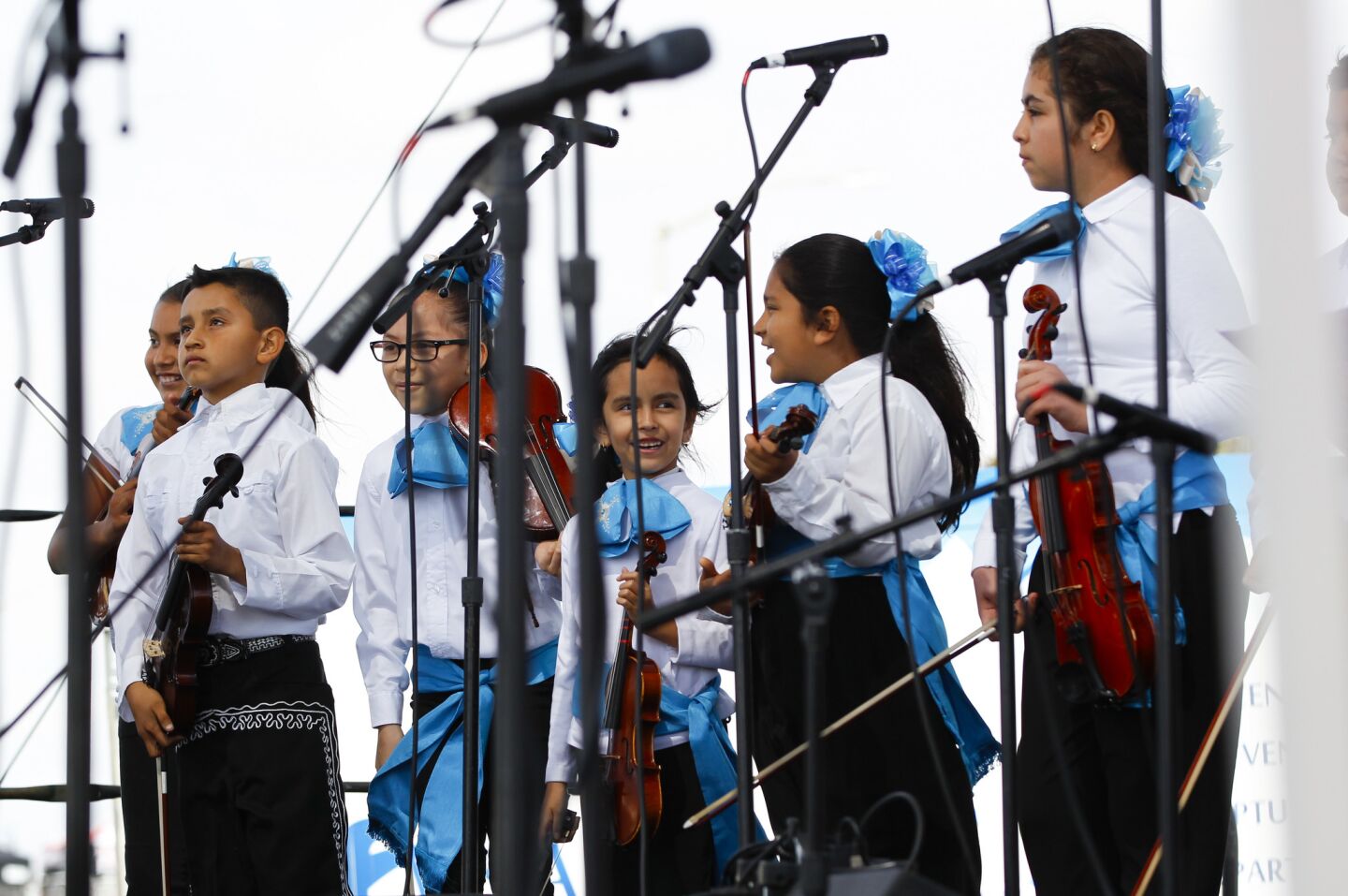 Students from the National City School District, grades 1 through 8, walk on stage to perform for the crowd at the annual International Mariachi Festival in National City.