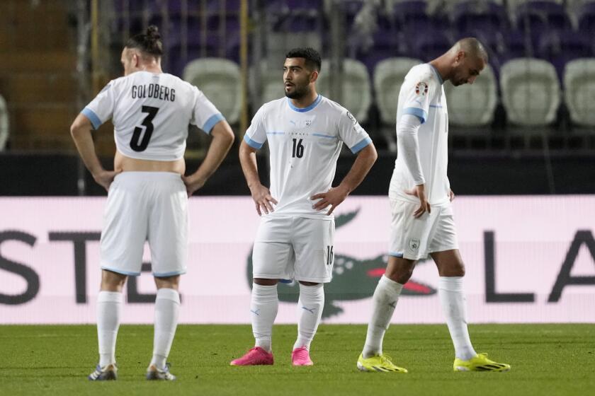 Israel players react at the end of the Euro 2024 qualifying play-off soccer match between Israel and Iceland, at Szusza Ferenc Stadium in Budapest, Hungary, Thursday, March 21, 2024. (AP Photo/Darko Vojinovic)