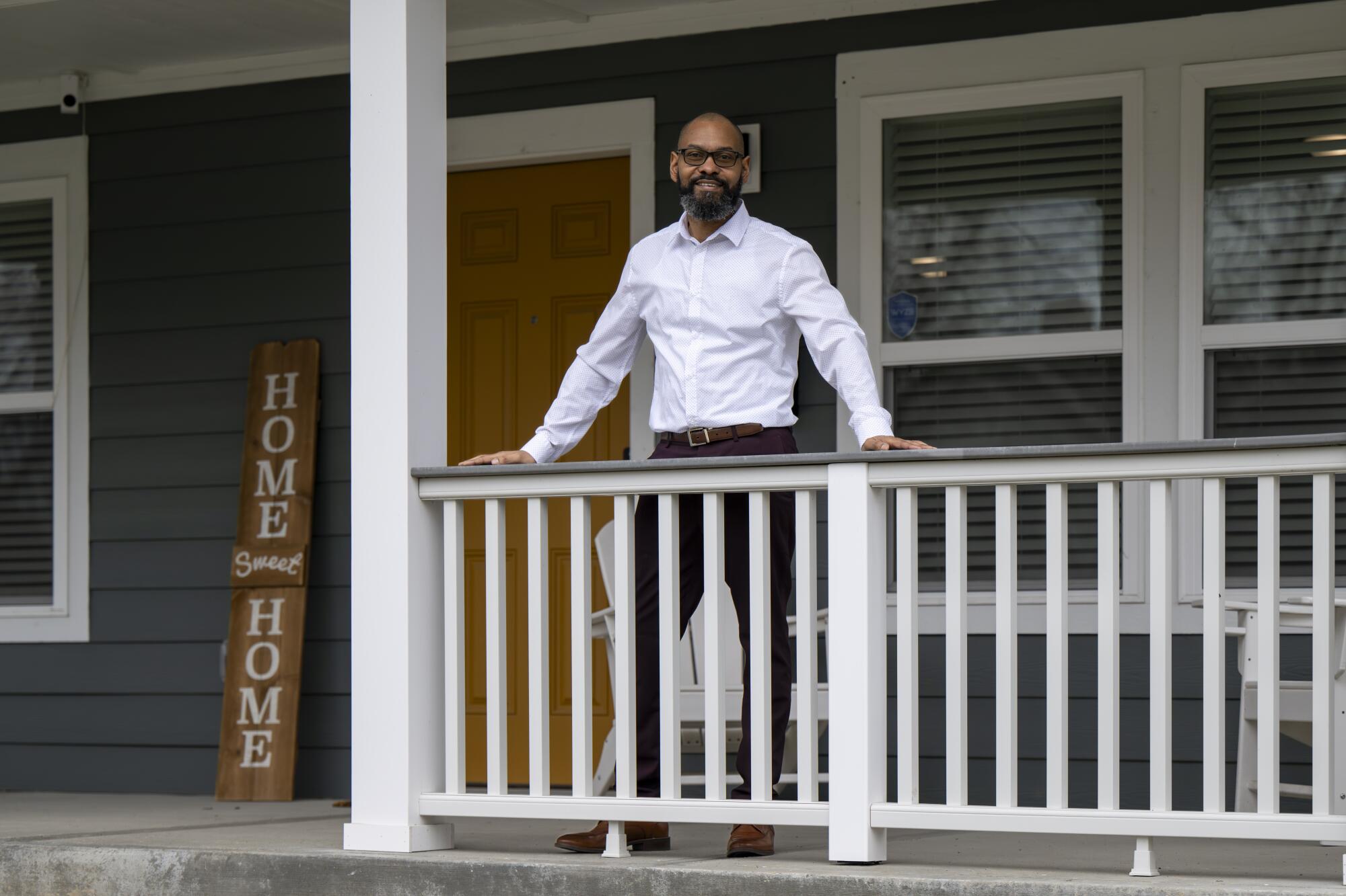 Montez Day on the porch of his house.