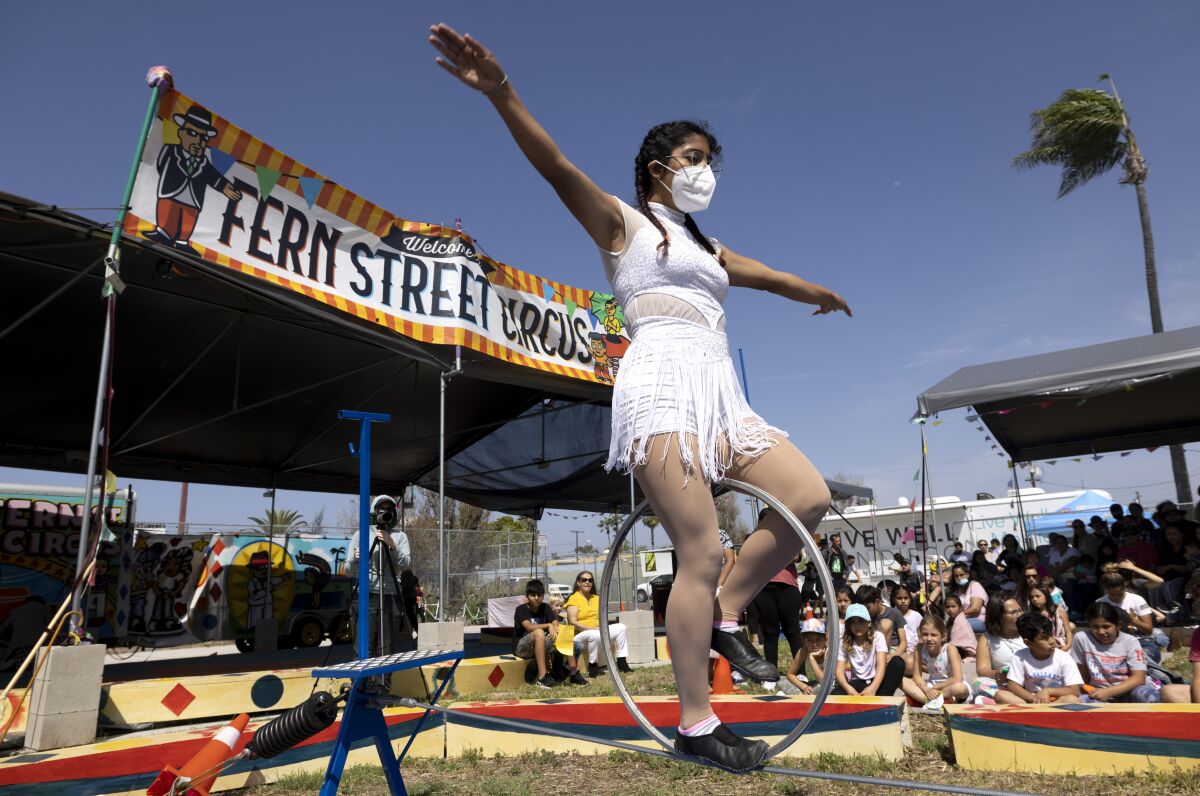 Angie Nava, 19, performs on a tightwire during the Fern Street Circus in City Heights