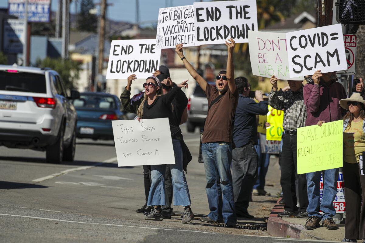 People gather near Dodger Stadium in January to protest COVID-19 vaccines, masks and lockdowns.