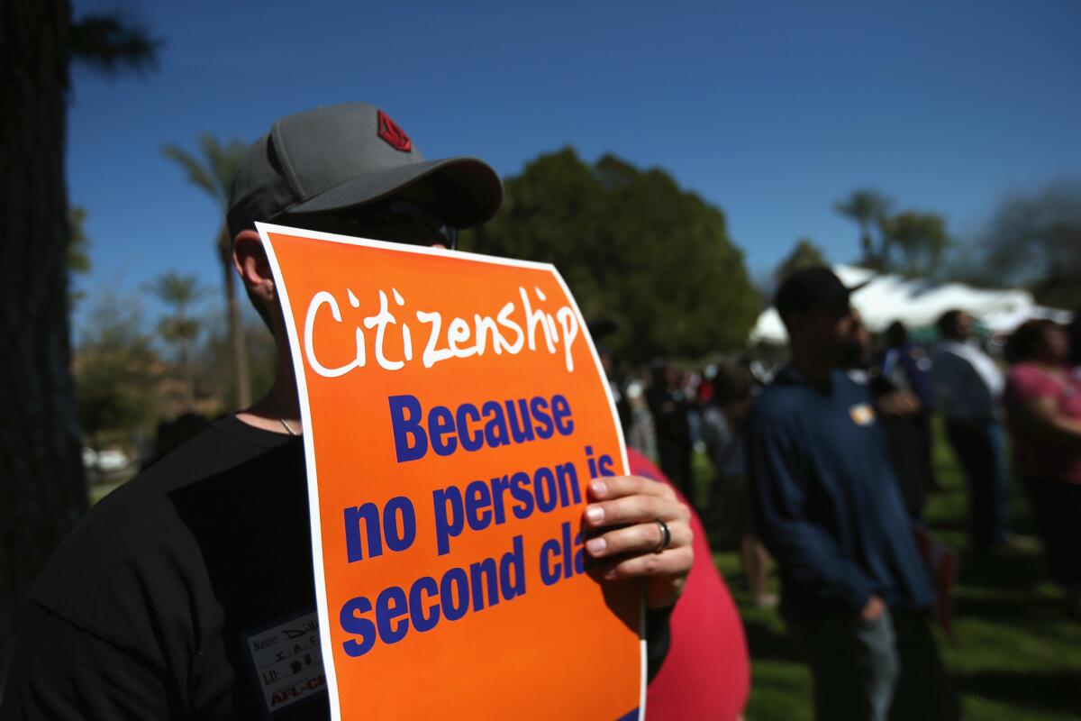 Union backers gather in support of national immigration reform at the Arizona state Capitol in Phoenix in March.