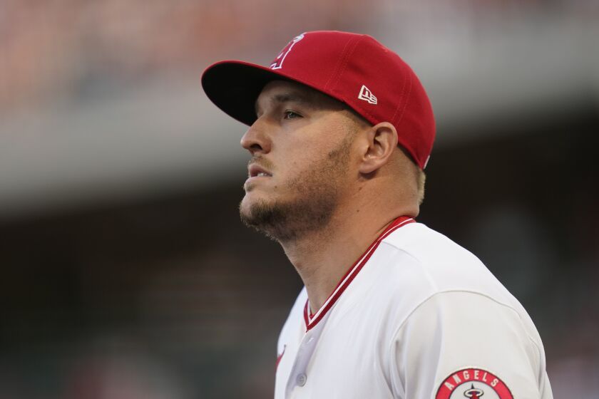 Angels center fielder Mike Trout walks on the field before a game against Houston on April 8, 2022.