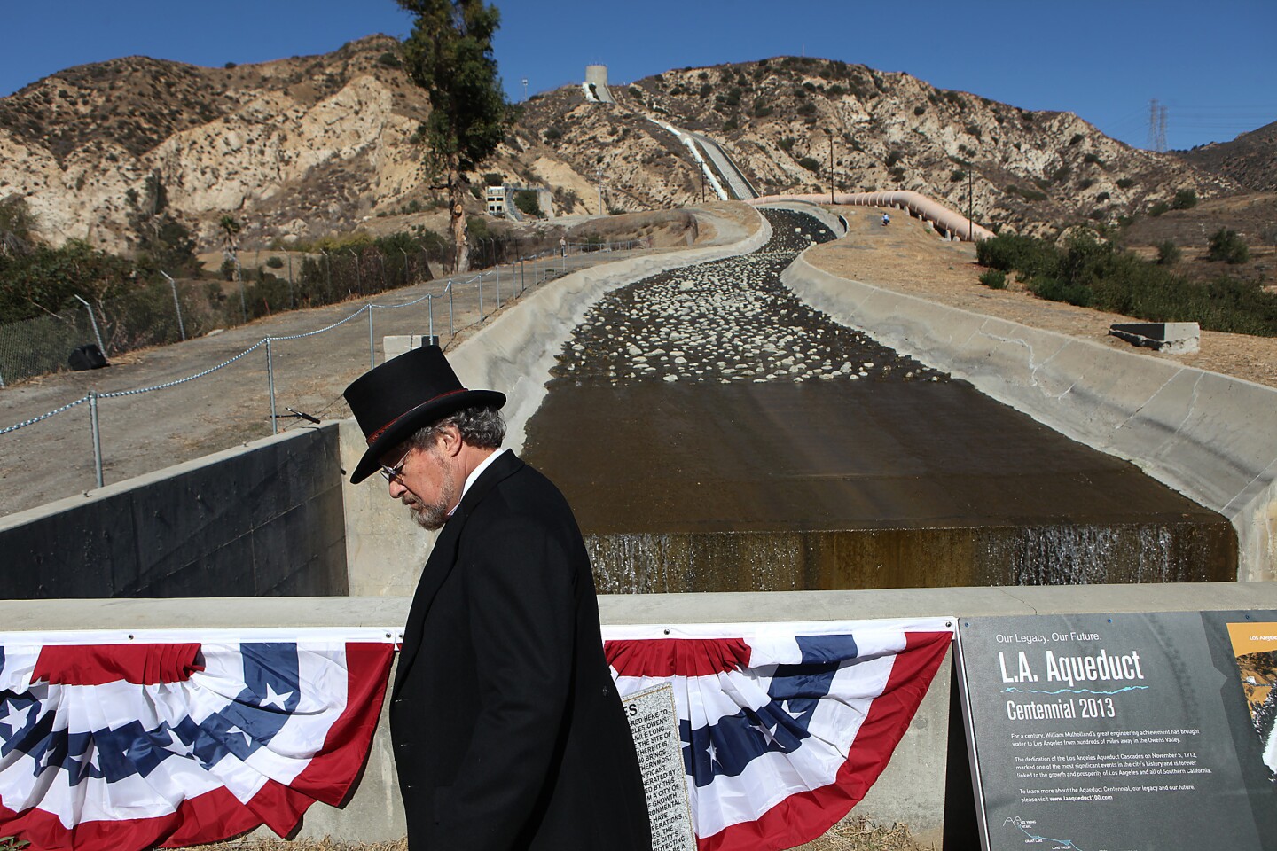 Douglas Larner, a member of E Clampus Vitus, a group dedicated to preserving the history of the American West, awaits the reenactment of the opening of the Los Angeles Aqueduct.